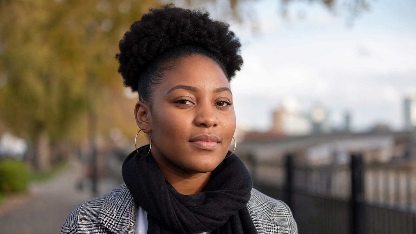 A dignified, hopeful portrait of a young Black woman conveying resilience and inner strength